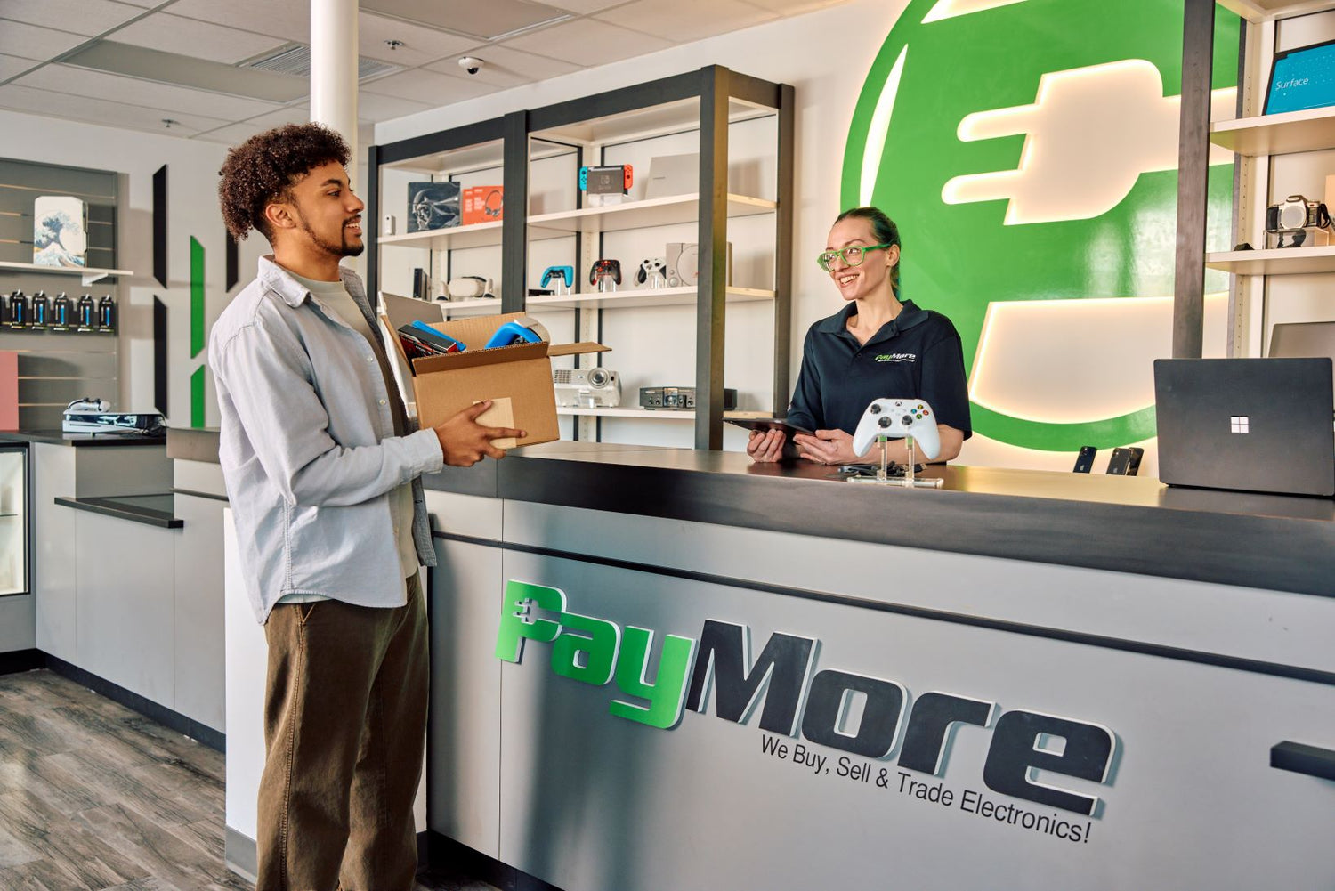 man holding a box of electronics